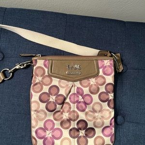 Cream Coach crossbody with multi colored C’s.